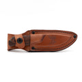 Benchmade's Hidden Canyon Hunter in it's leather sheath. 