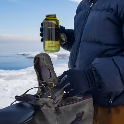 Grabbing a water bottle out of the Taconite Bike Trunk Bag