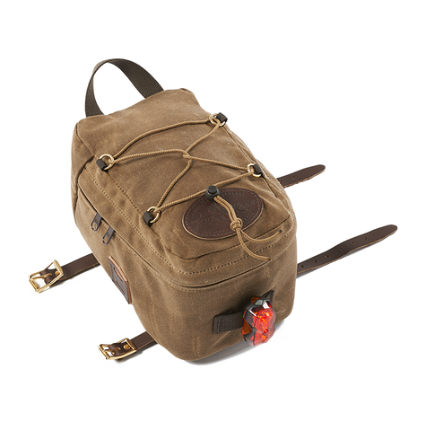 Internally lined walls to give the bag structure even when empty, leather lashing squares on each side for leather straps to attach additional items, and a webbed cotton loop on the back to attach a rear bike light.