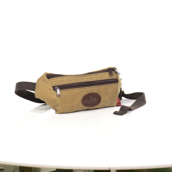 Highly water resistant waxed canvas, heavy duty zippers, and webbed cotton straps make this small hip pack is great for walks, runs, and hikes.