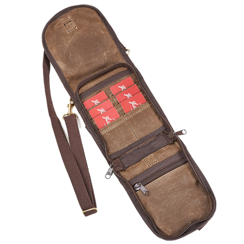 The inside has a zippered pocket and several slip pockets above for card storage and can be zipped closed before the flap is secured over.